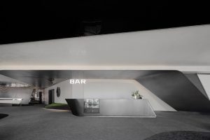 深圳福田卓越城現(xiàn)代風(fēng)格辦公室裝修設(shè)計(jì)前廳吧臺洽談區(qū)效果圖