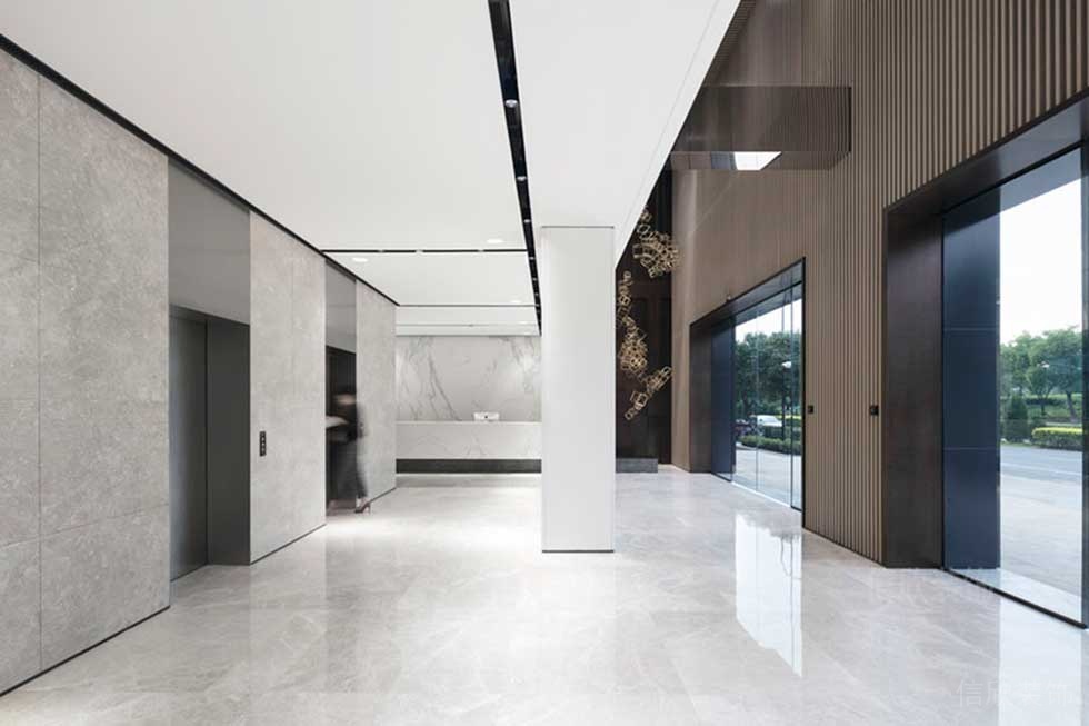 大理石地板電梯等候區域裝修木質玻璃智能門辦公室大廳效果圖