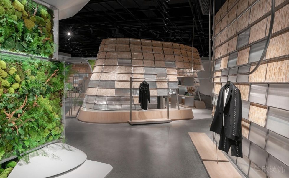 深圳市龍華區(qū)大浪原木風(fēng)生態(tài)智庫(kù)服裝店裝修設(shè)計(jì)綠植背景墻