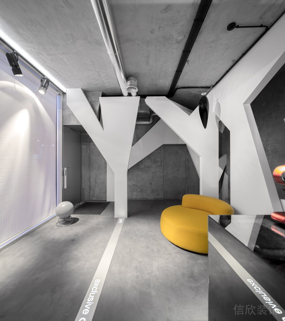 水泥灰地板裝修懸吊式藝術品裝修辦公室員工休息區(qū)效果圖